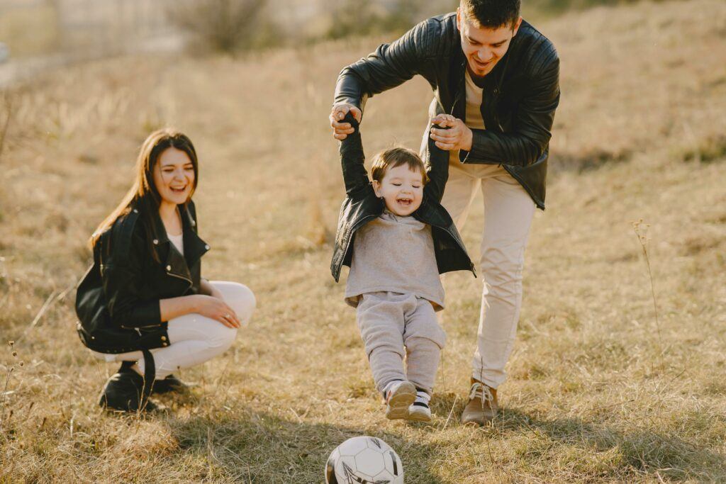 A couple playing with there child