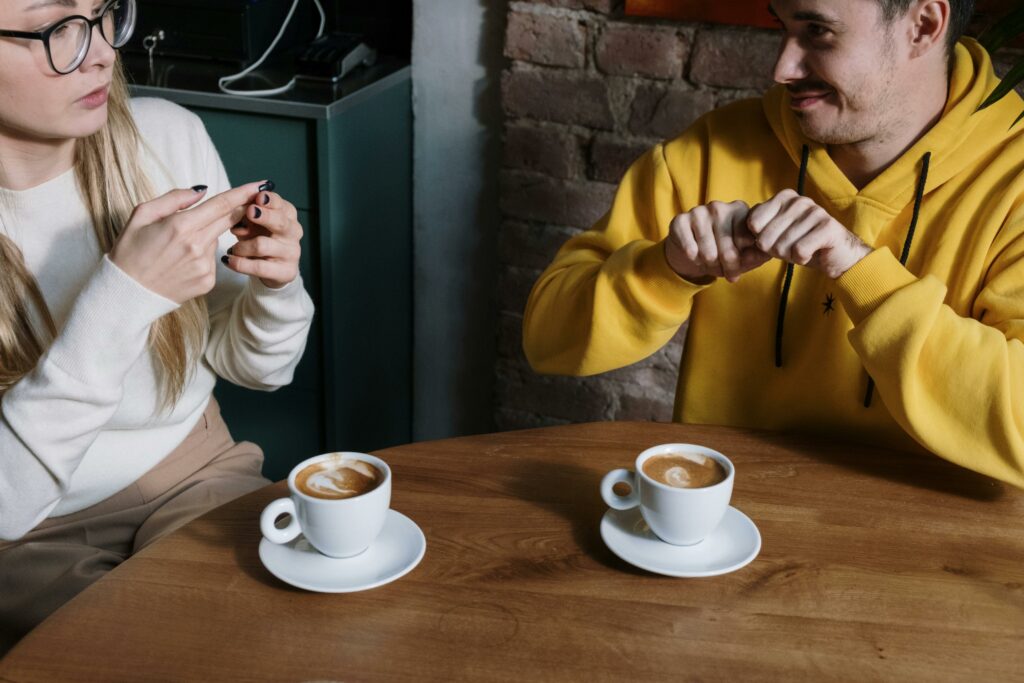 A couple taking things slow. Having a cup of coffee at a coffee shop.