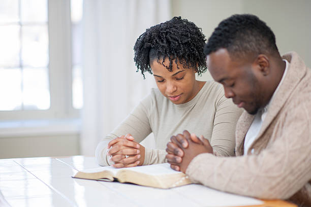 Christian couple praying together.