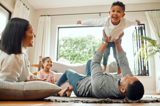 A stay at home dad playing with his kids.