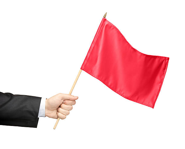 Hand holding a red flag isolated on white background. 10 Signs of a Emotionally Abusive Relationship